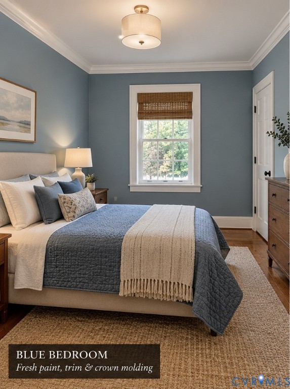 Bedroom interior featuring crown molding, neutral wall-to-wall paint, wood-finish flooring, and a semi-flush mount light fixture