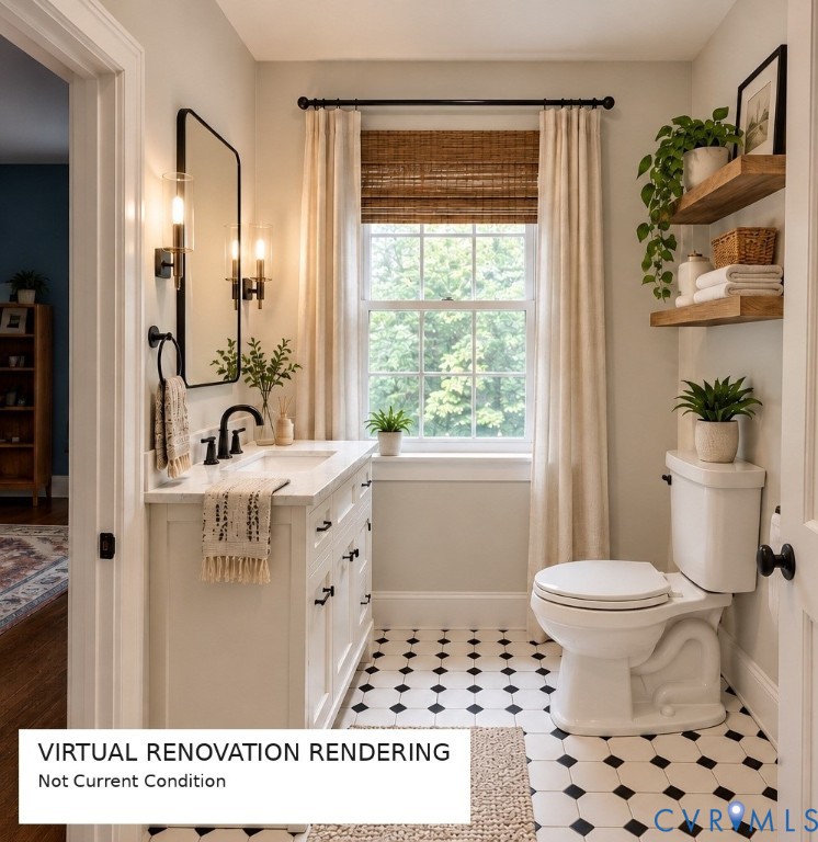 White vanity with integrated basin and stone countertop, matte black hardware and wall-mounted light fixtures, framed rectangular mirror, and geometric patterned floor tiling