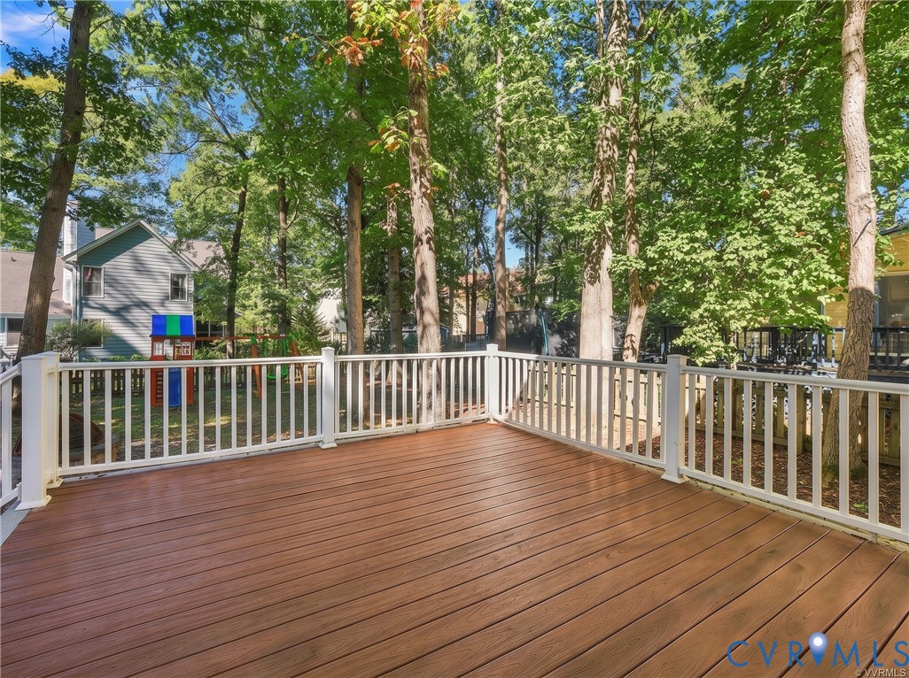 Enjoy peaceful views of the wooded backyard from the spacious deck, perfect for outdoor gatherings or quiet evenings at home.