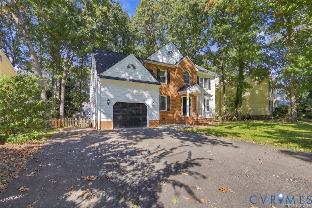This home provides an attached garage with paved double width driveway offering convenient parking and additional storage space.