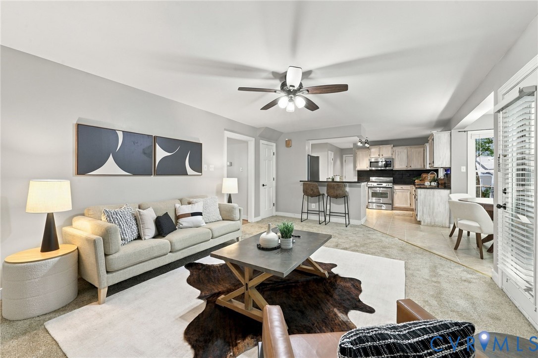 Spacious family room with brand new carpet and convenient access to the kitchen, breakfast area, and rear deck.