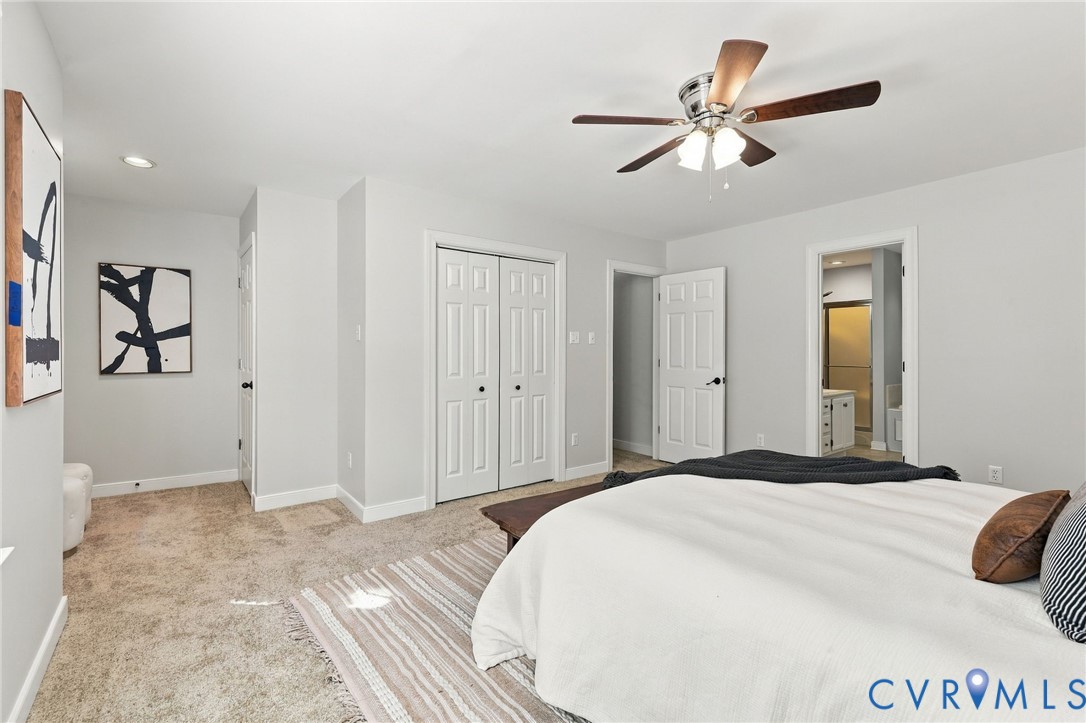 This primary bedroom is generously sized with ample closet space (two closets!) and convenient access to the private en-suite bathroom.