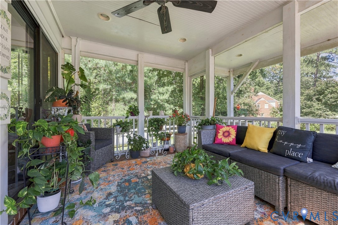 Screened-in porch featuring a beadboard ceiling, recessed lighting, a ceiling fan, and white railing