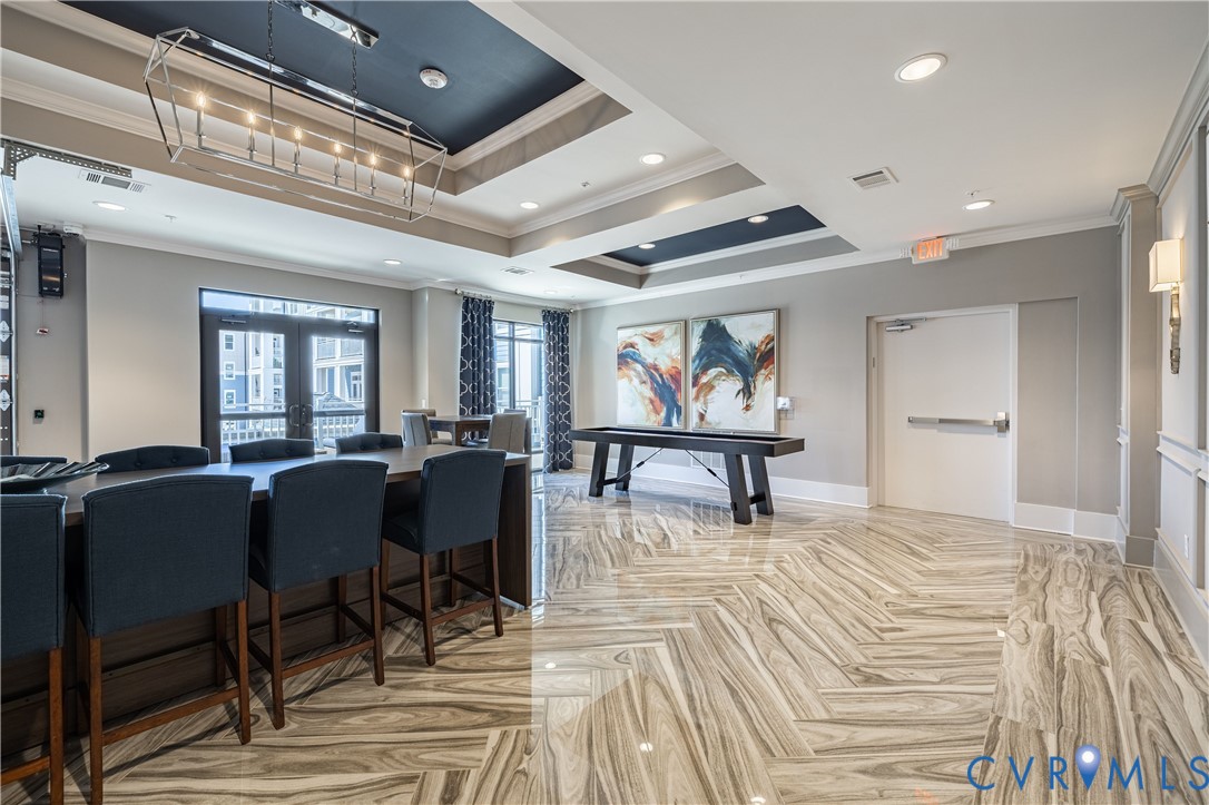 Herringbone-patterned stone flooring, coffered ceilings with contrast paint, geometric metal pendant lighting, and recessed ceiling illumination Herringbone-patterned stone flooring, coffered ceilings with contrast paint, geometric metal pendant lighting, and recessed ceiling illumination