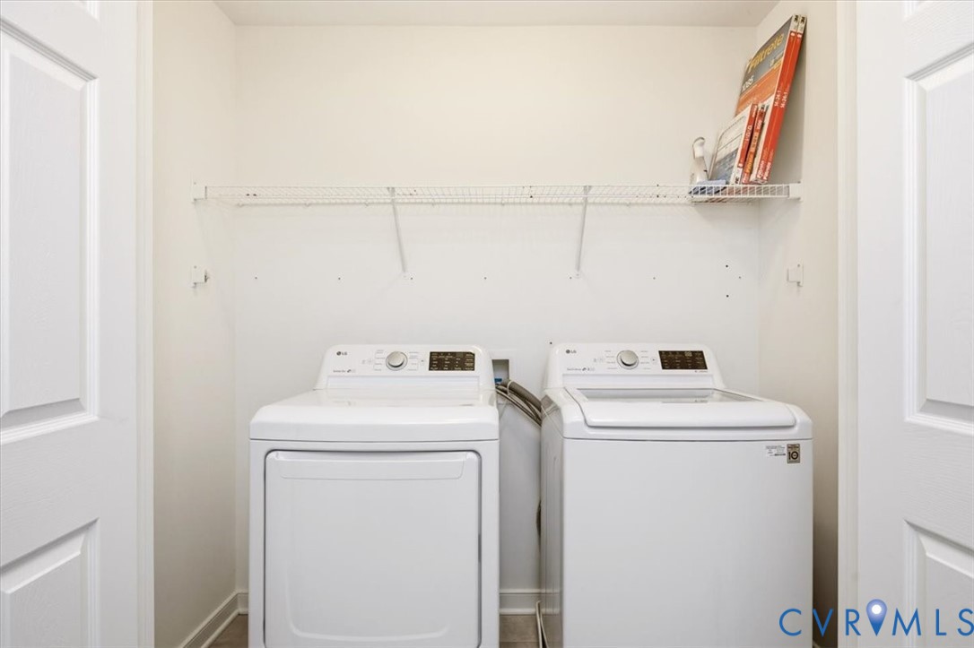 Laundry area featuring a dedicated closet, white paneled doors, and wire shelving