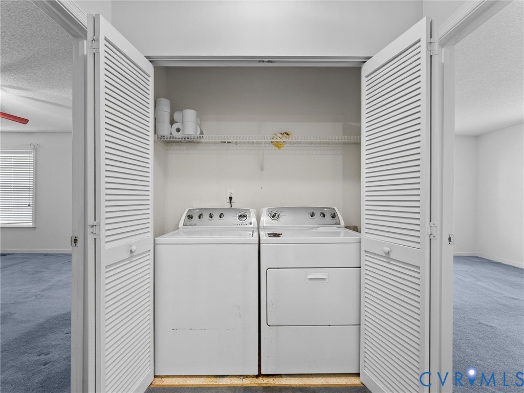Laundry closet featuring white louvered bifold doors and built-in wire shelving