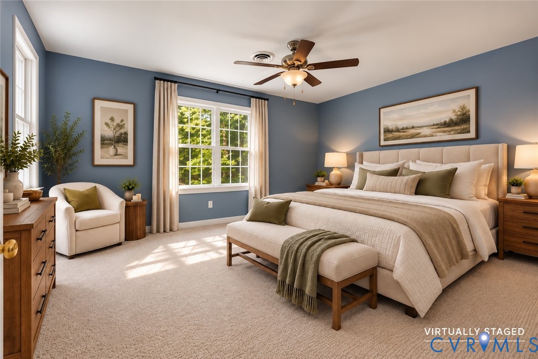 Neutral-toned carpeting, multi-pane windows with integrated hardware, and a ceiling-mounted fan with integrated light fixture