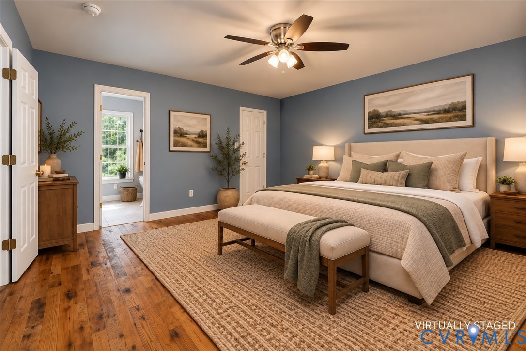 Wood-finish flooring, multi-pane window, ceiling fan with integrated lighting, and multi-panel interior doors