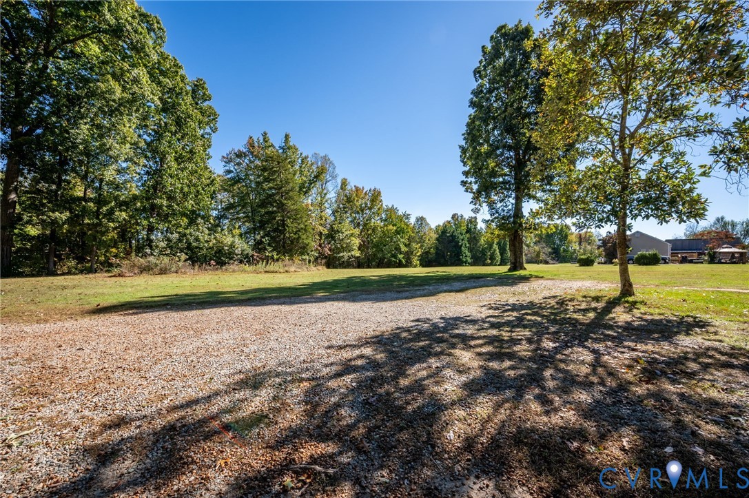 Expansive grounds out front with an abundance of parking options, & expansive yard.