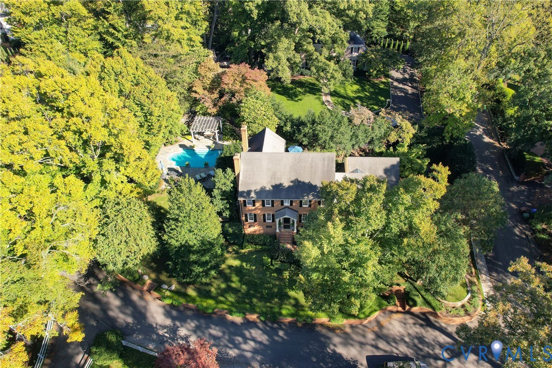 Elevated view of the property and pool