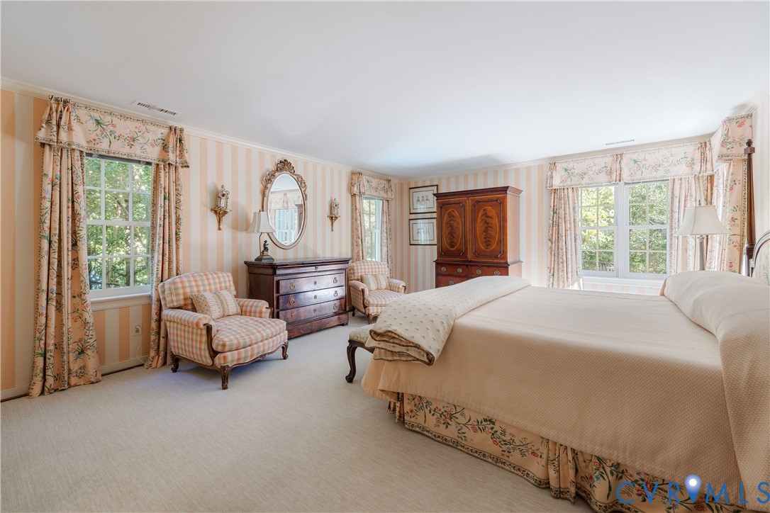 Light streams in from multiple windows with pretty views.