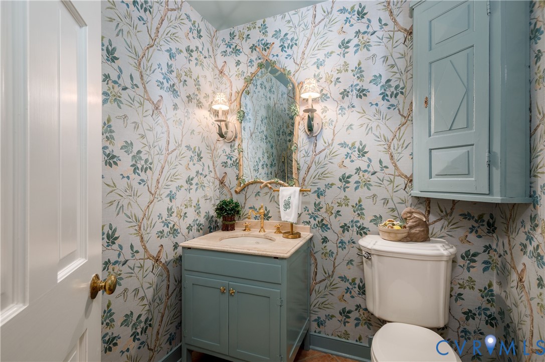 The pretty powder room is just off the back hallway.