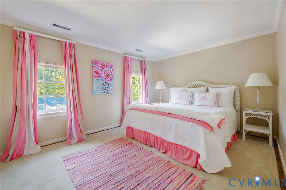 Bedroom Two has wall-to-wall carpet and accesses the shared bath.