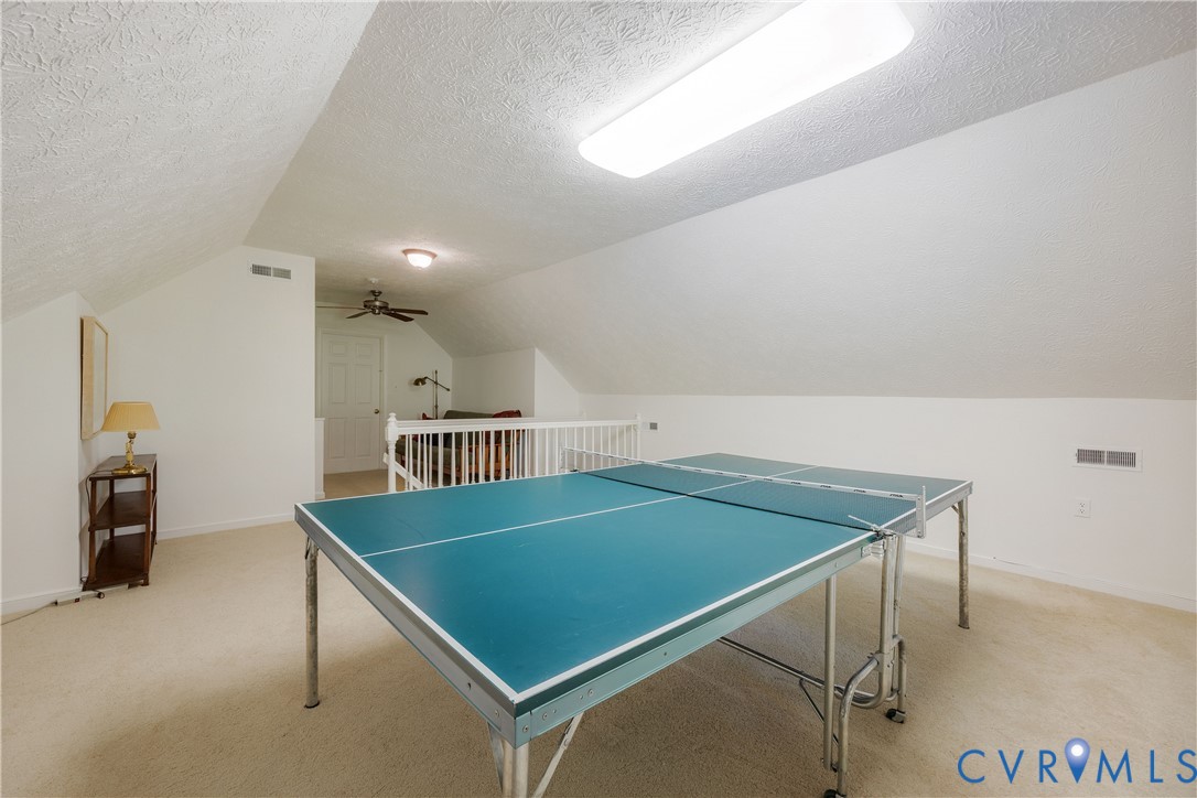 Third floor bonus room is a great hang-out space with room for a ping pong table.