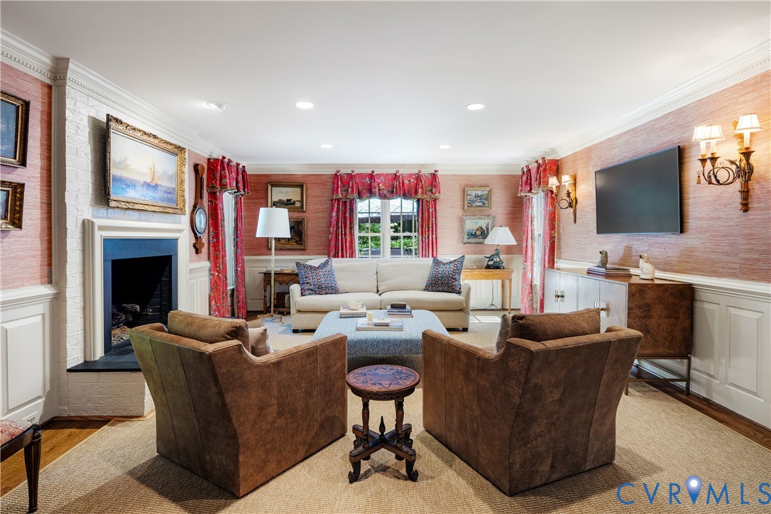 The living room opens directly to the spacious family room and second fireplace with gas logs.