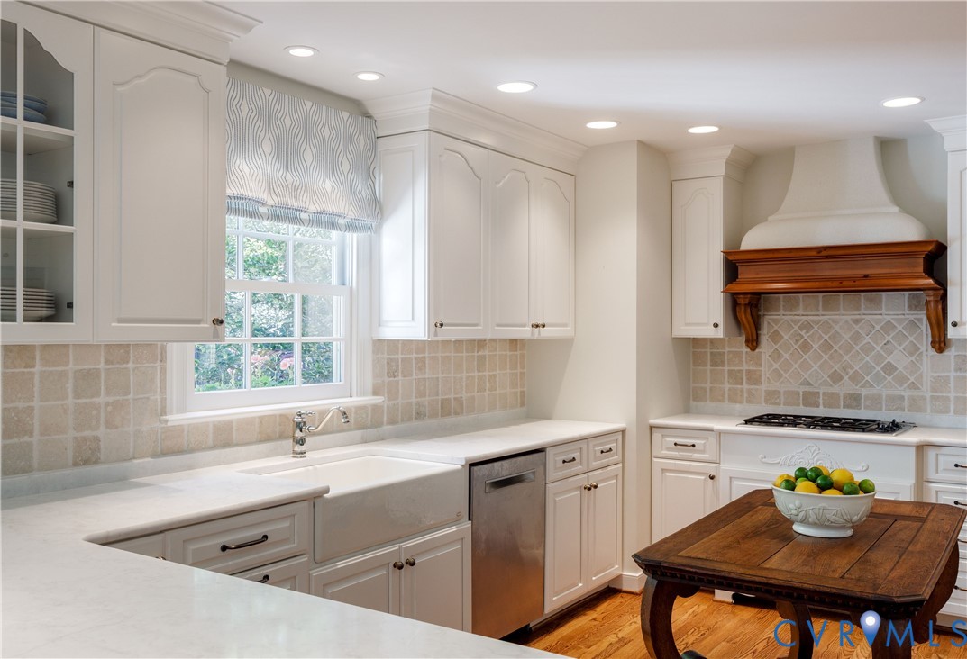 The farmhouse sink is topped by a window with views to the garden.