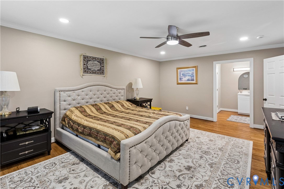 Wood-finish flooring, recessed lighting, and a ceiling fan with integrated light fixture