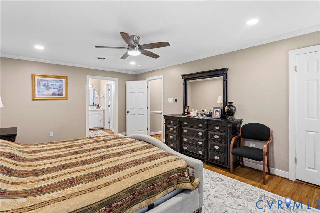 Interior room featuring hardwood flooring, recessed lighting, and a multi-blade ceiling fan with integrated lighting