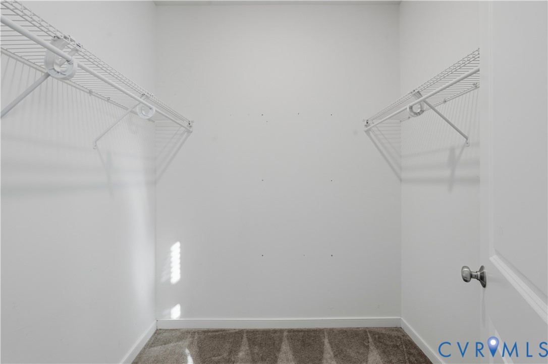 1 of 2  Primary bedroom Walk-in closets.