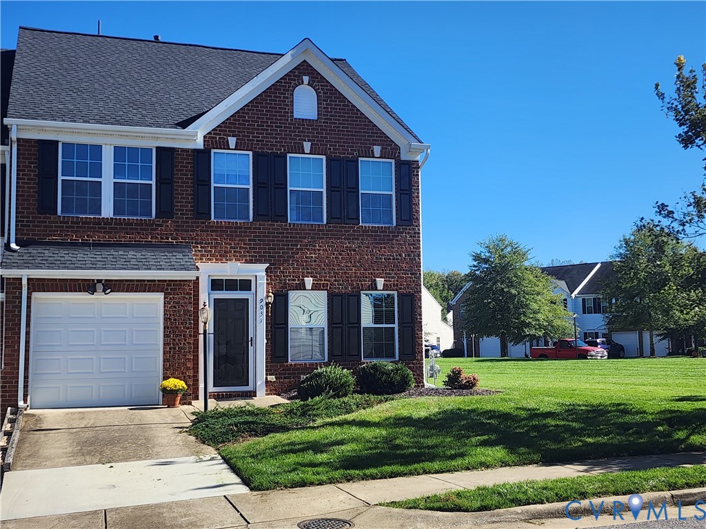 Two-story brick exterior featuring a shingled roof, black louvered shutters, an integrated single-car garage, and a concrete driveway