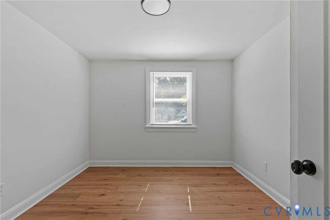 Neutral wall tones and wood-finish flooring