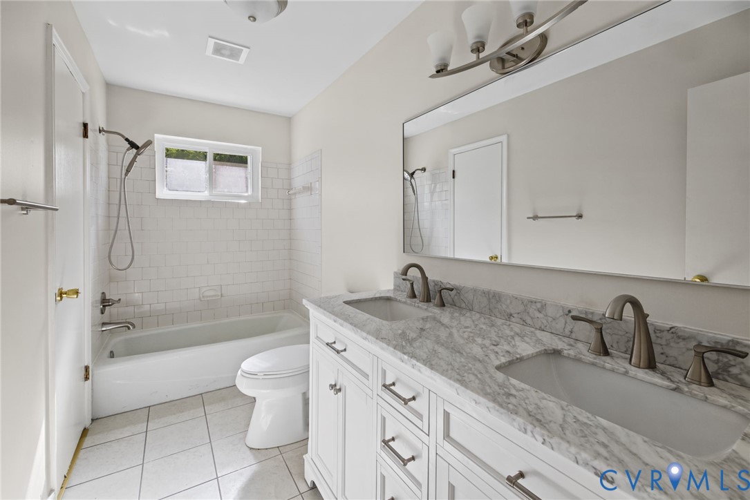 Full bathroom with new vanity and tile