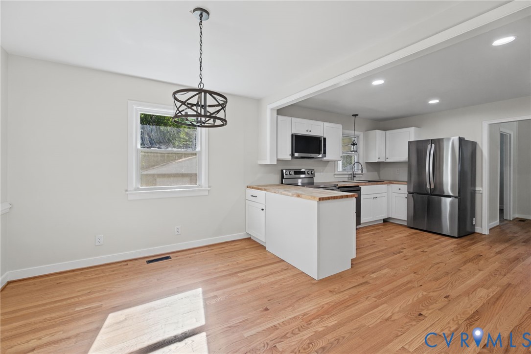 Eat in kitchen with hardwood floors