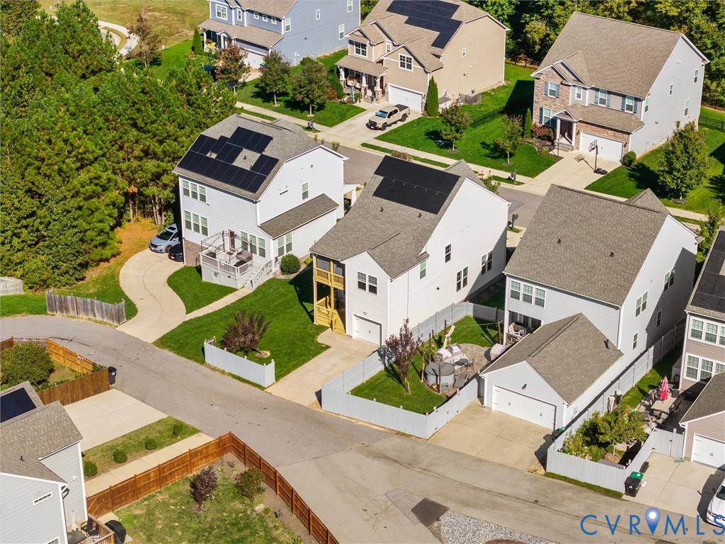 Aerial view of the rear showing owned solar panels