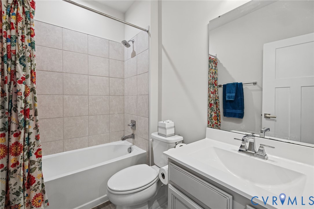 1st floor hall bathroom, conveniently adjacent to guest suite.