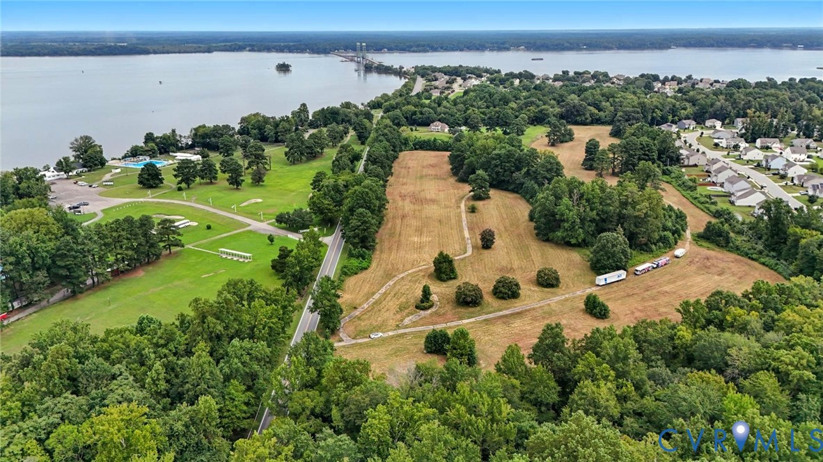 Expansive acreage featuring mature tree stands, cleared terrain, and proximity to the waterfront