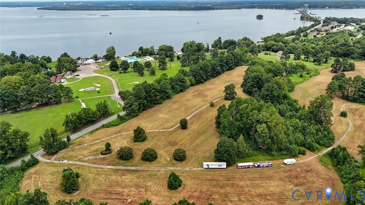 Expansive acreage featuring mature trees, rolling topography, and direct waterfront access Expansive acreage featuring mature trees, rolling topography, and direct waterfront access