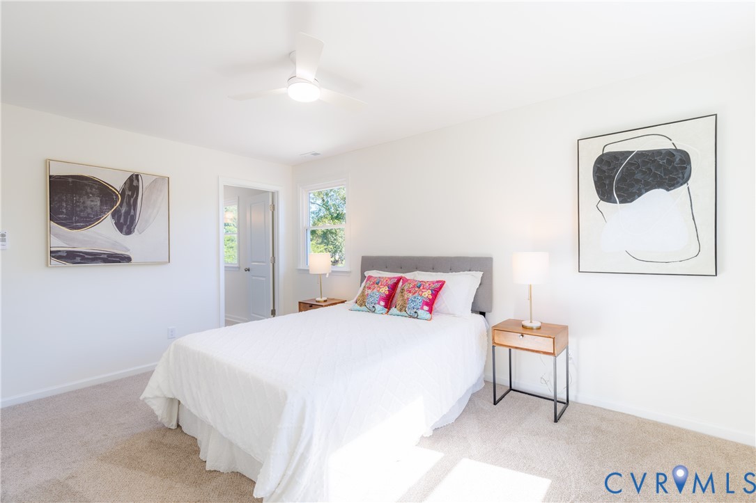 Primary bedroom with ceiling fan