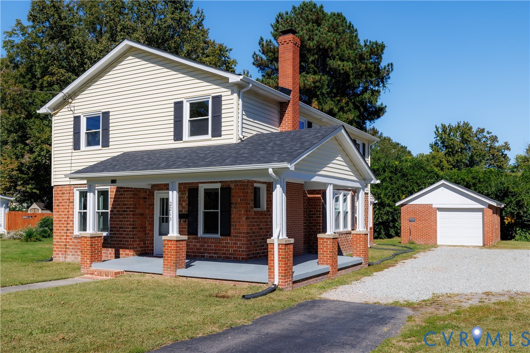 Brick and vinyl exterior with detached garage Brick and vinyl exterior with detached garage
