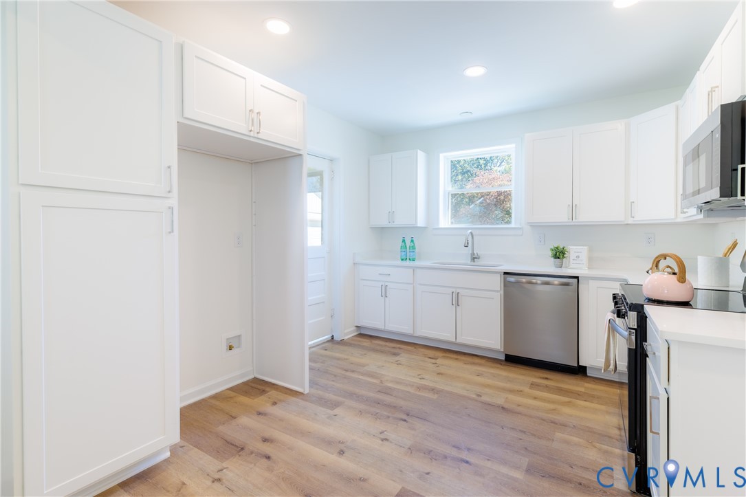 Kitchen with new cabinets and pantry storage