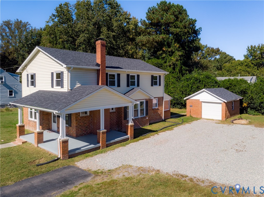 Aerial view of the home and garage