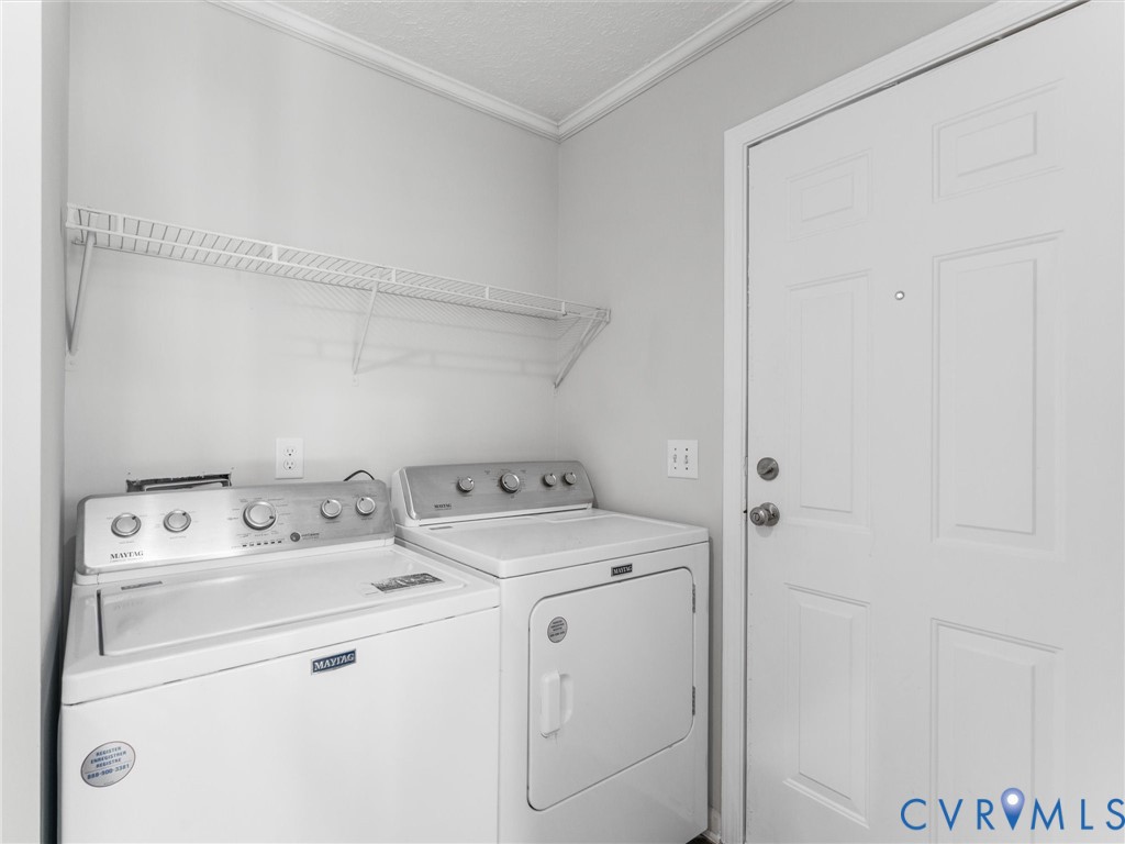 Laundry area featuring built-in wire shelving and a six-panel door