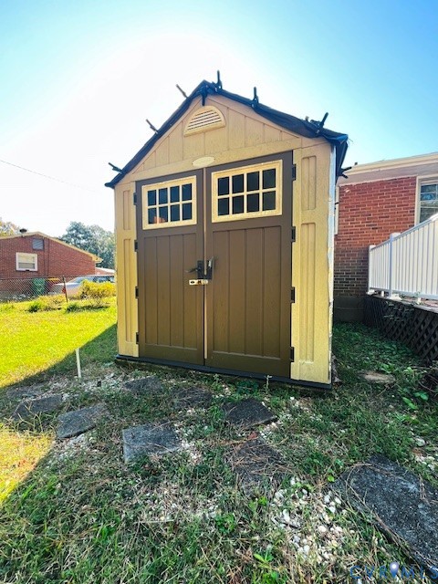Storage shed featuring double doors, dual window panes, gable roof, and integrated ventilation