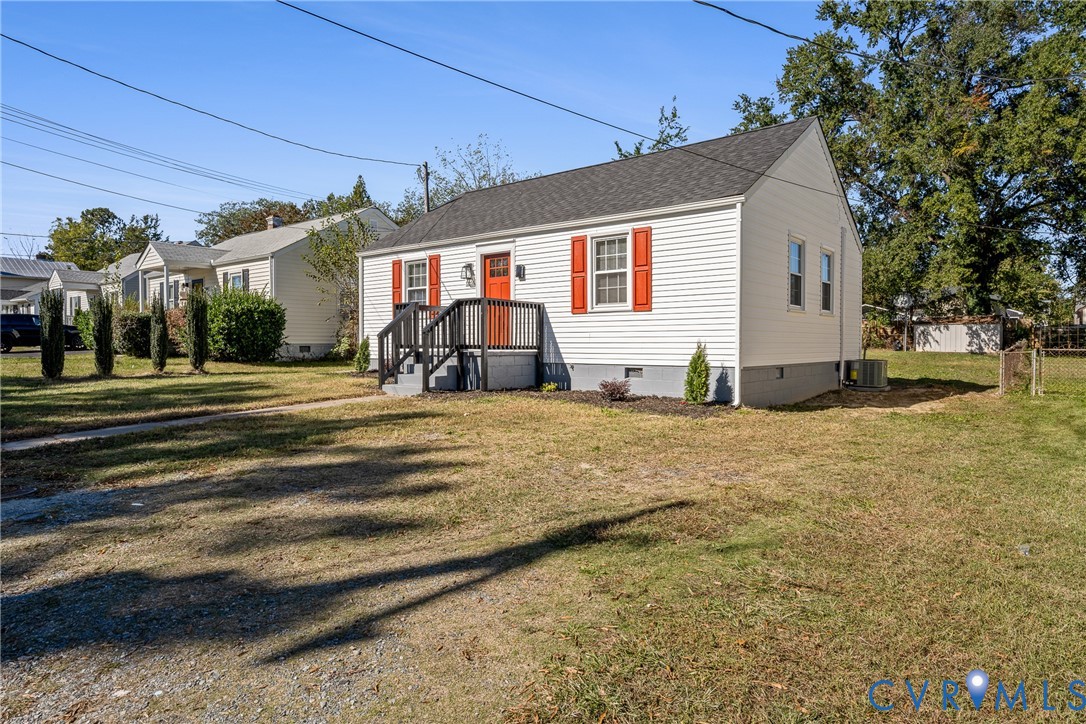 Exterior featuring horizontal siding, contrasting shutters, gable roof, and raised wooden front porch with railing
