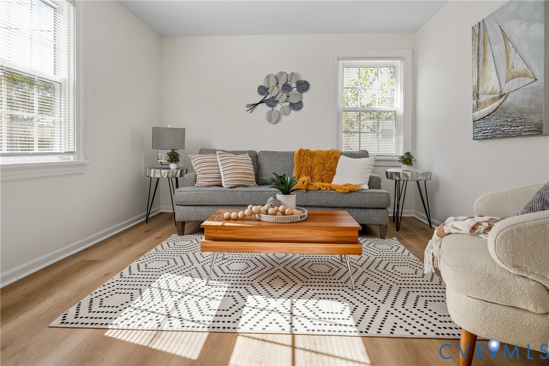 Neutral walls, wood-finish flooring, and multi-pane windows Neutral walls, wood-finish flooring, and multi-pane windows