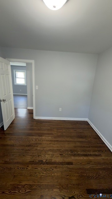 Neutral wall tones, wood-finish flooring, and a flush-mount ceiling fixture