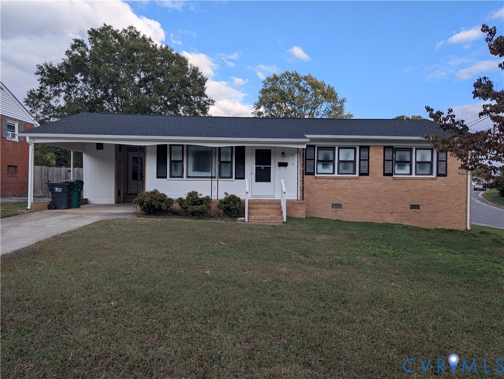 Single-story residence featuring a combination brick and siding exterior, an attached carport, dark window shutters, and a shingled roof Single-story residence featuring a combination brick and siding exterior, an attached carport, dark window shutters, and a shingled roof