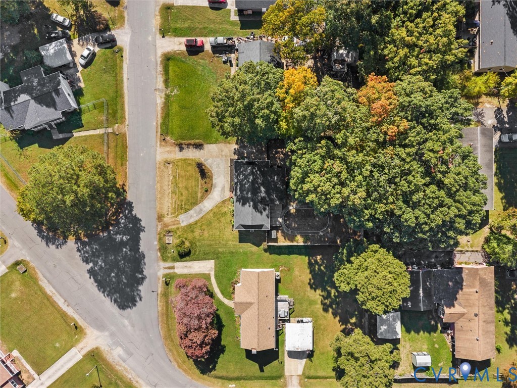 Aerial perspective of residential lots featuring established hardwood trees and expansive turf areas
