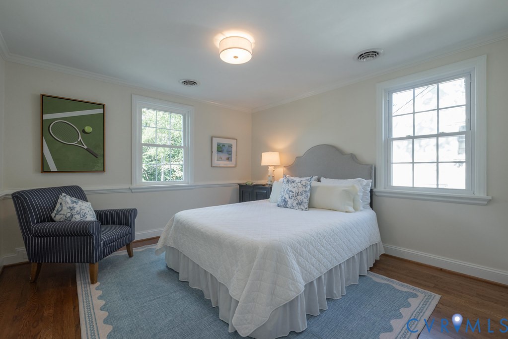 Hardwood flooring, dual multi-pane windows, and crown molding