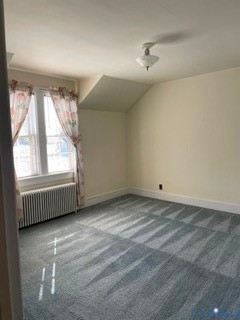 Large window, wood flooring under carpet