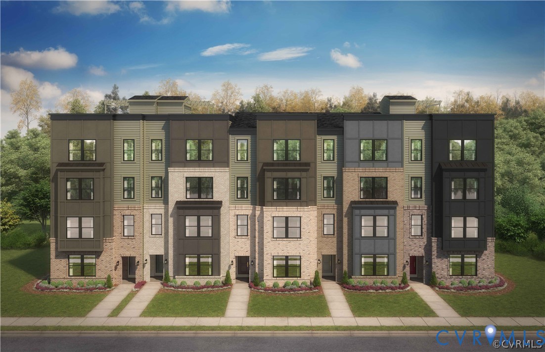 Modern multi-story exterior featuring a mix of brick and metal paneling, prominent bay windows, multi-pane fenestration, and dedicated concrete entry paths Modern multi-story exterior featuring a mix of brick and metal paneling, prominent bay windows, multi-pane fenestration, and dedicated concrete entry paths