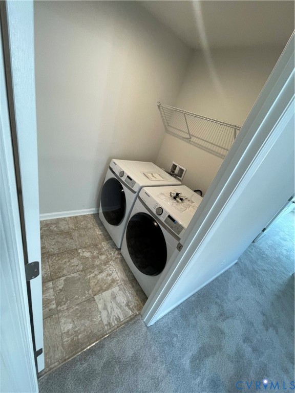 Laundry space featuring tile flooring and an integrated wire shelving unit