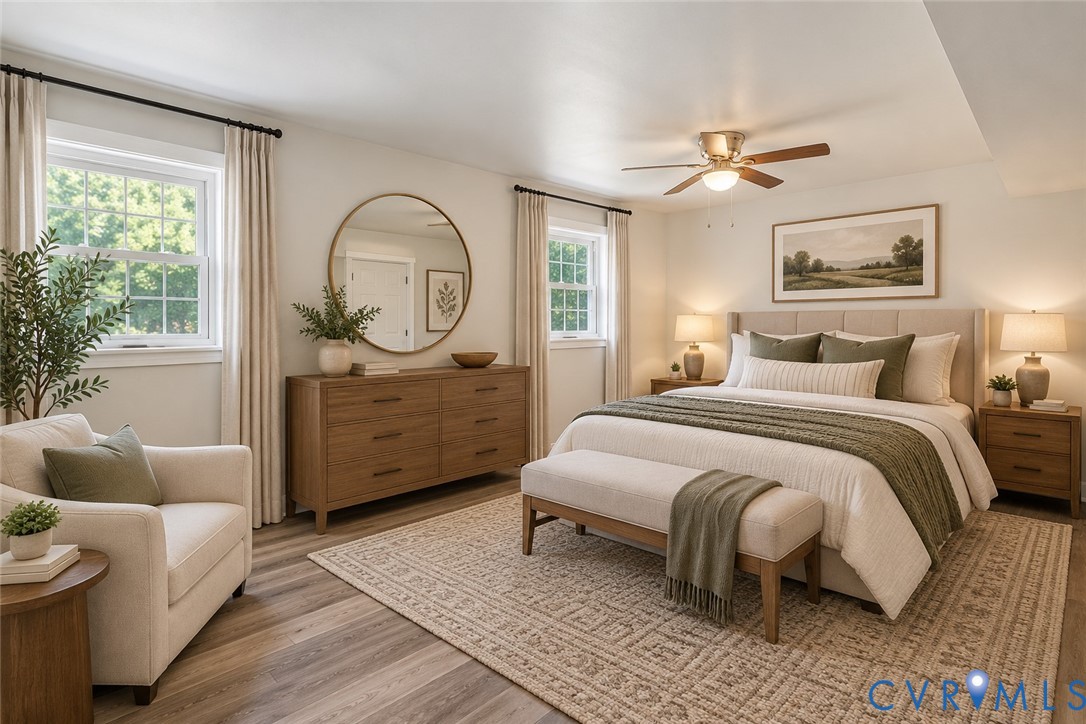 Wood-finish flooring, dual windows with decorative hardware, and a ceiling-mounted light fixture with fan, ai staged