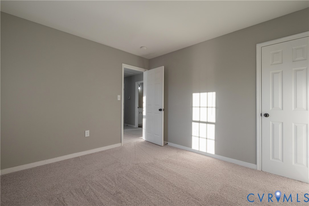 Bedroom #2 with new carpet, paint a large closet