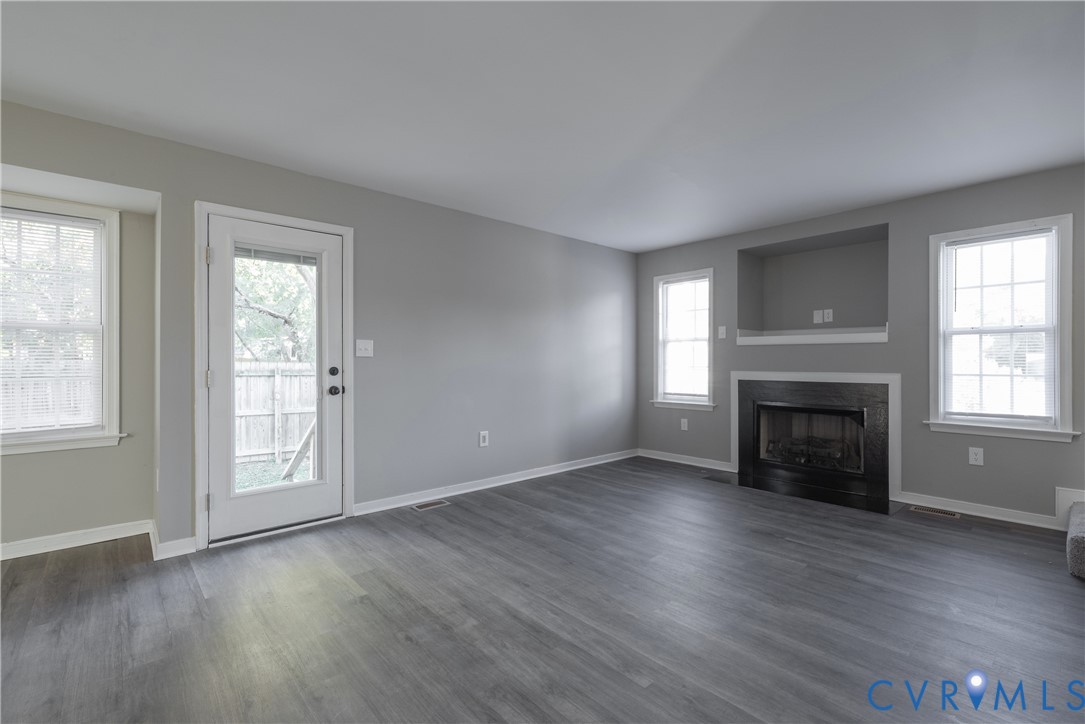 Family Room with back yard access and ample natural light