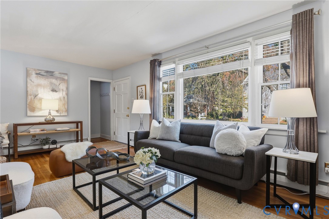 Hardwood flooring, multi-pane window configuration, and solid-core six-panel door